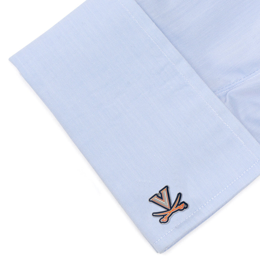 A light blue shirt cuff featuring a pair of orange and blue NCAA University of Virginia Cavaliers Cufflinks.