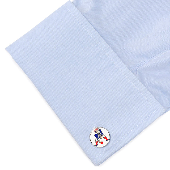 Round NFL New England Patriots Vintage Cufflinks featuring the team logo on a light blue dress shirt cuff.