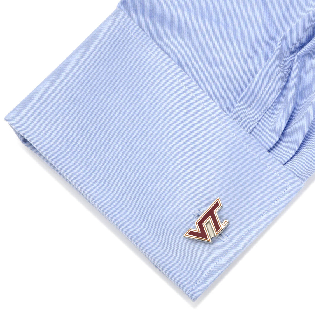 NCAA Virginia Tech Hokies Cufflinks featuring the maroon and orange VT logo attached to a light blue dress shirt cuff.