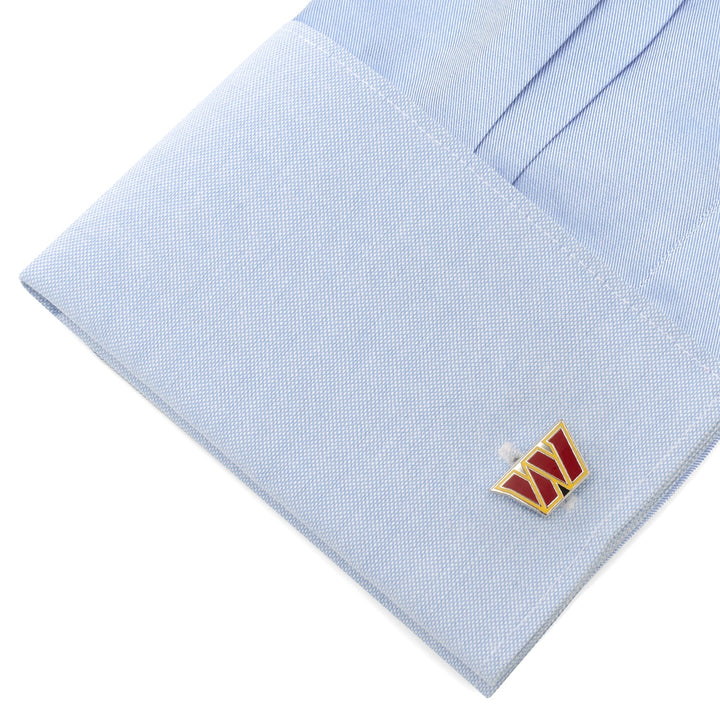 A light blue French cuff shirt sleeve featuring gold and burgundy NFL Washington Commanders Cufflinks.