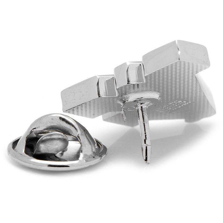 The metallic back of an NCAA West Virginia Mountaineers Lapel Pin featuring a post and a removable clutch backing.
