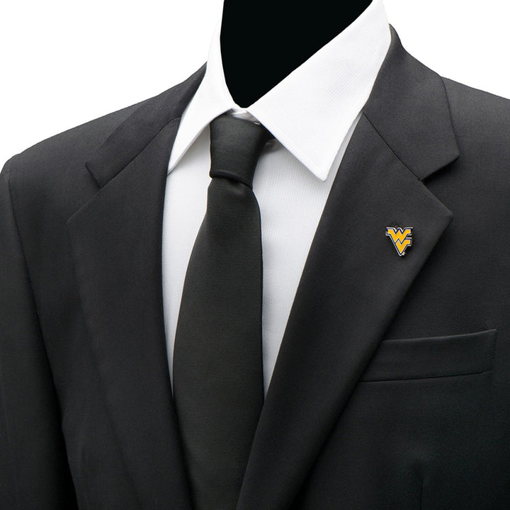 A gold and blue NCAA West Virginia Mountaineers Lapel Pin shaped like the “WV” logo attached to the lapel of a black suit jacket.