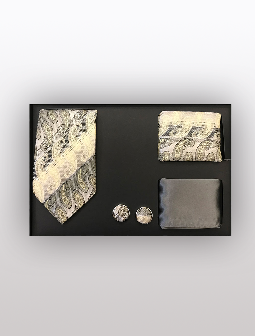 Discover the Men's Four Piece Taupe Paisley Stripe Patterned Gift Box by Vesuvio Napoli: an ideal men's accessory set for formal occasions. It includes a slim fit paisley tie, pocket square, cufflinks, and a solid black tie clip, all beautifully presented in a sleek gift box.