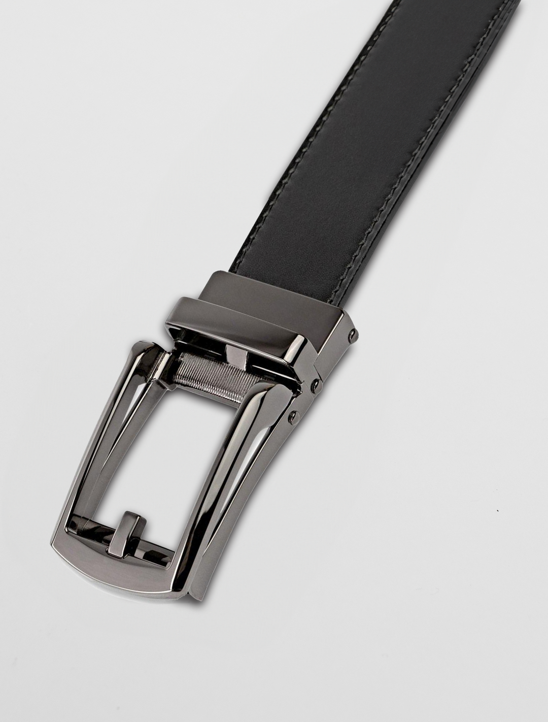 Men's black leather belt with a sleek graphite ratchet buckle from Carlo Fellini, set against a white background.