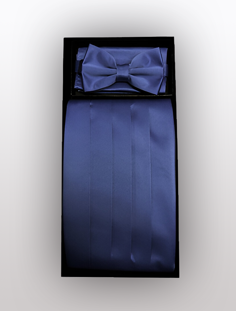 The Vesuvio Napoli Men's Poly Navy Cummerbund with Bow Tie & Hanky set includes a navy blue bow tie, pocket square, and a four-pleat cummerbund with an adjustable elastic band, all arranged neatly in a black box. Perfect for adding a touch of elegance to your formal wear.