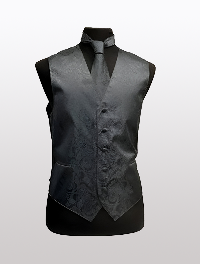 A black mannequin displays the Men's Paisley Charcoal Tuxedo Vest by Ckl, featuring an adjustable strap and a matching tie.