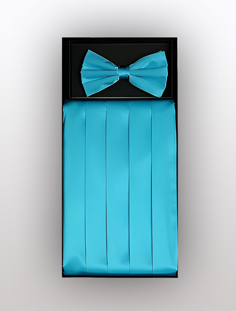 A neatly presented ensemble by Vesuvio Napoli features the Men's Silk Turquoise Cummerbund with Bow Tie, both made from 100% silk, set against a light grey backdrop.