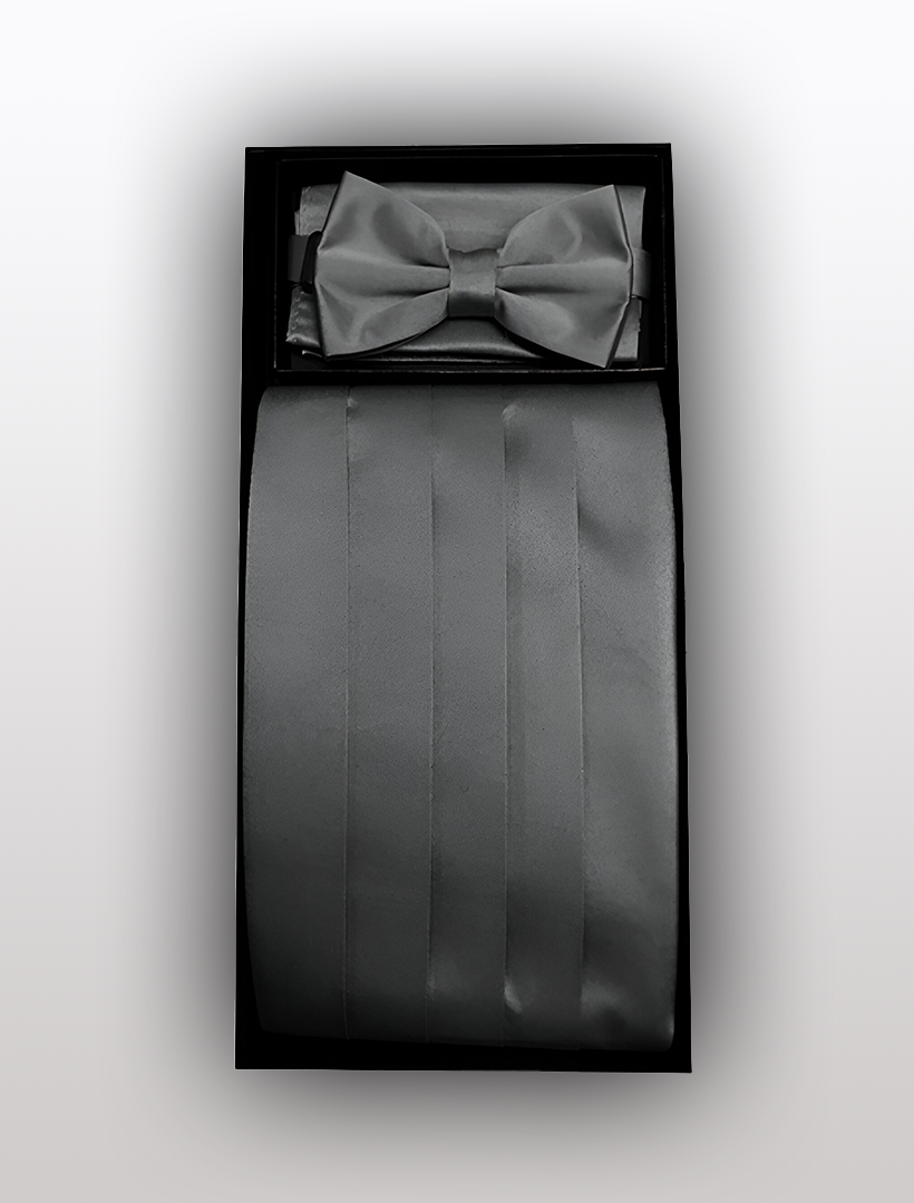 A black box contains a Vesuvio Napoli Men's Poly Black Cummerbund with Bow Tie & Hanky, neatly arranged, ideal for completing a polyester tuxedo ensemble.