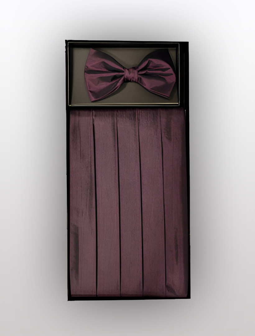 A box featuring the Men's Poly Burgundy Cummerbund with Bow Tie and Hanky by Vesuvio Napoli, complete with an adjustable elastic band for the perfect fit. Perfect for adding a touch of elegance to any tuxedo ensemble.
