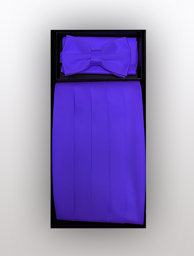 The Vesuvio Napoli Men's Poly Purple Cummerbund with Bow Tie & Hanky set is perfect for completing your formal wear ensemble, featuring a striking purple bow tie and cummerbund against a sleek black background.
