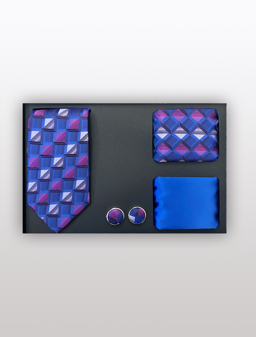 Introducing the Men's Four Piece Royal Blue and White Checkered Patterned Gift Box by Vesuvio Napoli. This exquisite set includes a slim fit tie with a geometric pattern, a matching pocket square, sophisticated cufflinks, and an additional solid blue pocket square. Elegantly arranged on a black background, this collection is perfectly packaged in a stylish gift box.