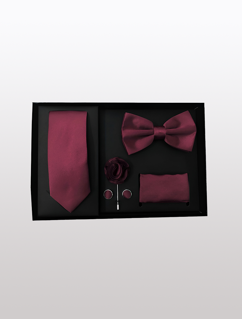 The Vesuvio Napoli Men's Five Piece Solid Burgundy Gift Box is an elegant choice, featuring a slim fit maroon tie, bow tie, lapel flower, pocket square, and cufflinks—ideal for formal events.