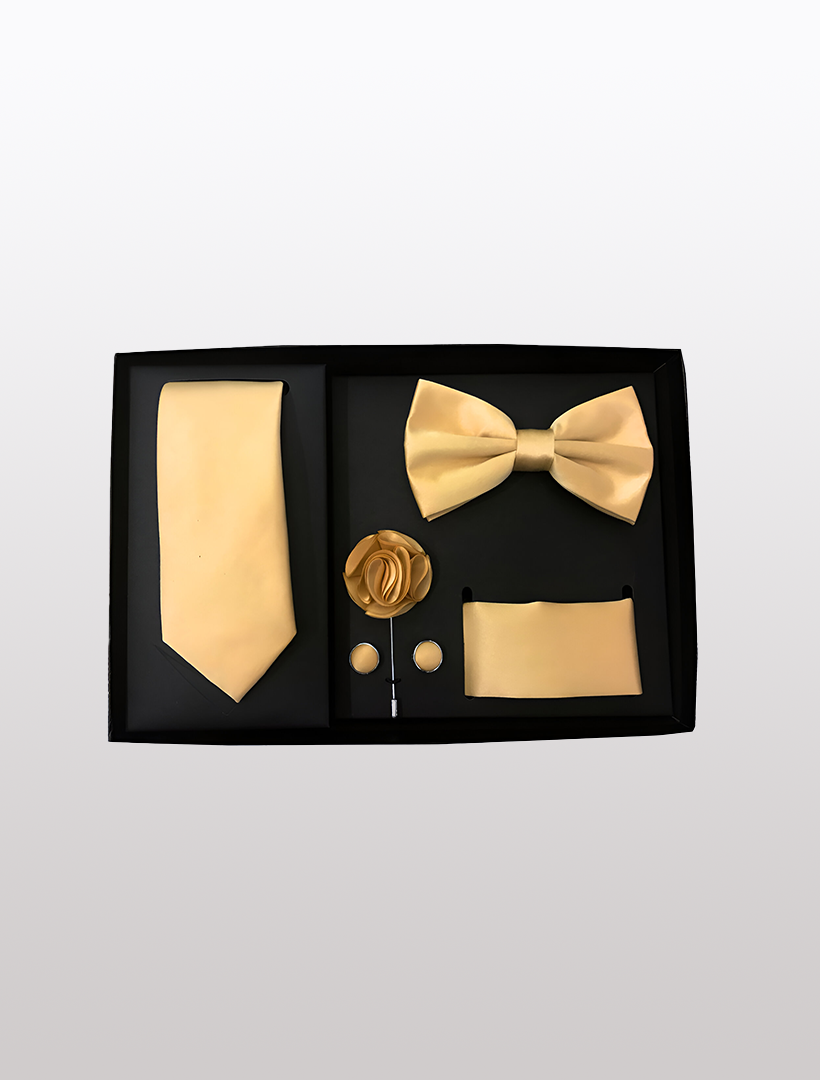 The Men's Five Piece Solid Gold Gift Box by Vesuvio Napoli features a stylish selection of accessories ideal for formal occasions. Enclosed in an elegant gift box are a slim fit tie, bow tie, lapel flower, cufflinks, and pocket square.