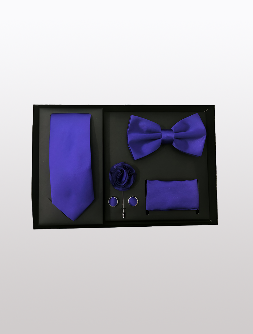 The Men's Five Piece Solid Purple Gift Box by Vesuvio Napoli is an ideal choice for polished looks at formal events, featuring a tie, bow tie, lapel flower, cufflinks, pocket square, and tie bar.