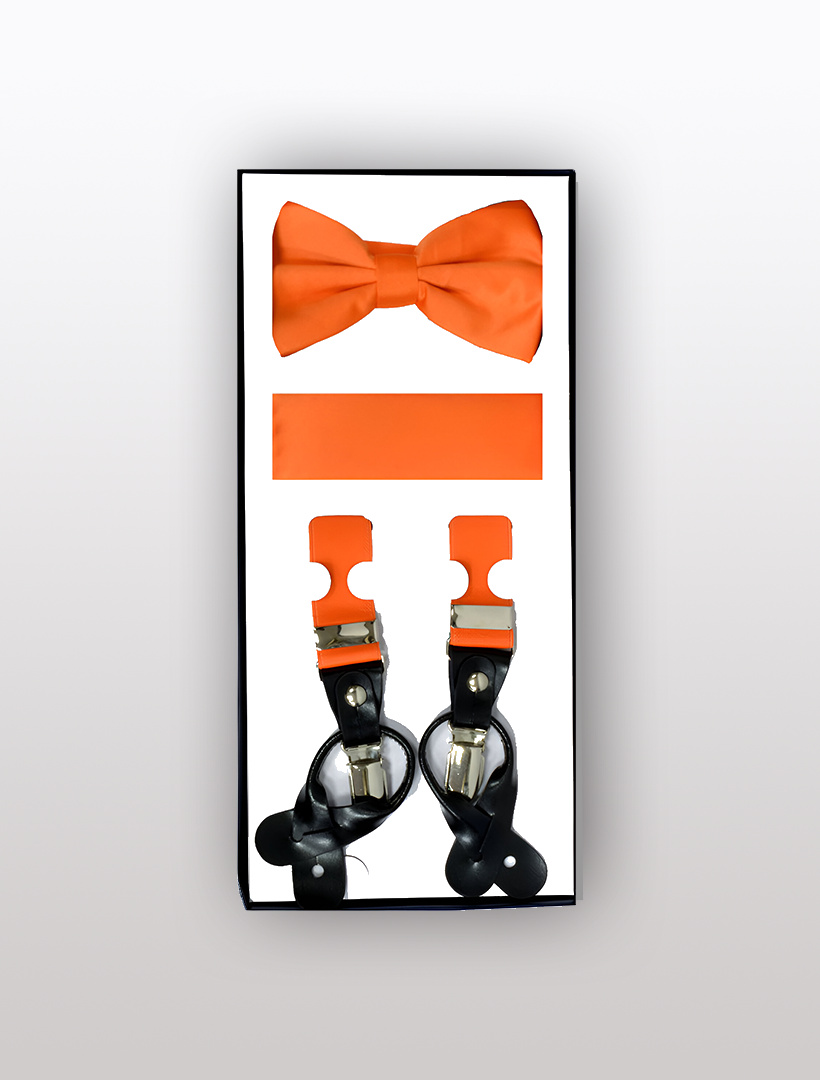 The Men's Skinny Orange 3 Piece Suspenders Set from Vesuvio Napoli features an adjustable orange bow tie, a pocket square, and black suspenders with orange accents, all beautifully packaged.