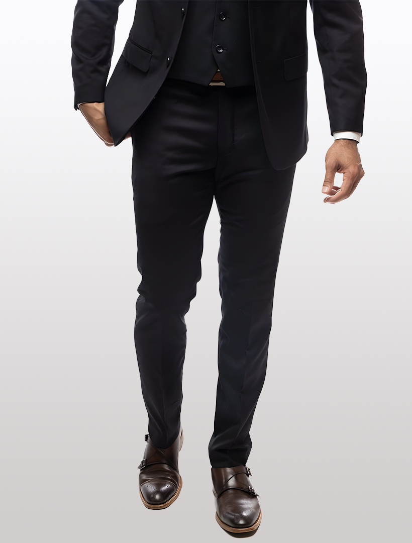 A person wearing Karako Separate Black Men's Slim-Fit Suit Separates Pants and dark brown dress shoes walks forward against a light background.