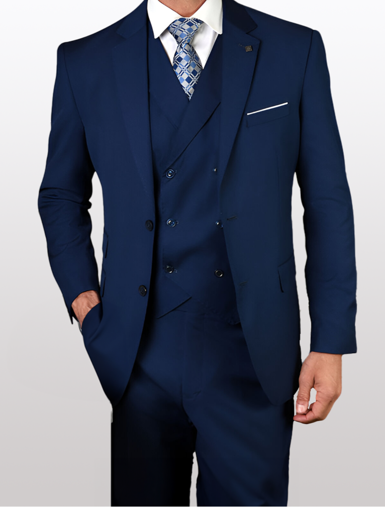 Against a simple backdrop, an individual confidently sports the Statement Mens Sapphire Blue Modern Fit 100% Wool Vested Suit by the brand Statement, enhanced by a stylish patterned tie. With one hand casually placed in their pocket, they exude an aura of elegance and sophistication.
