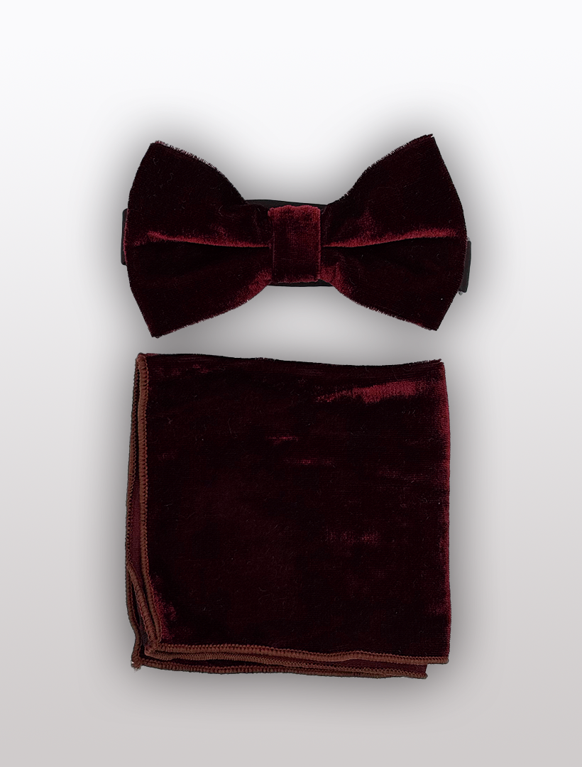 The Ckl Burgundy Velvet Bowtie and Hanky set, offering an adjustable fit, elegantly presented on a light gray background.