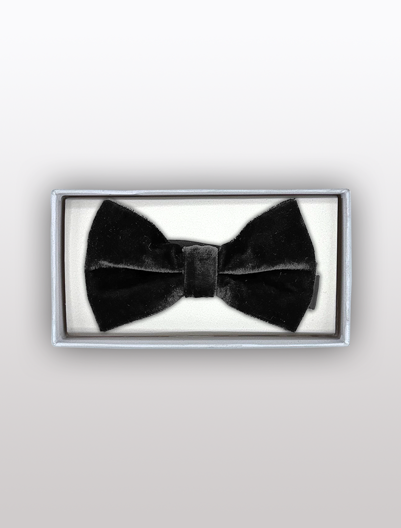 The Men's Charcoal Velvet Bowtie by Ckl is beautifully presented in a rectangular white box on a neutral background, providing an adjustable fit with its pre-tied design.