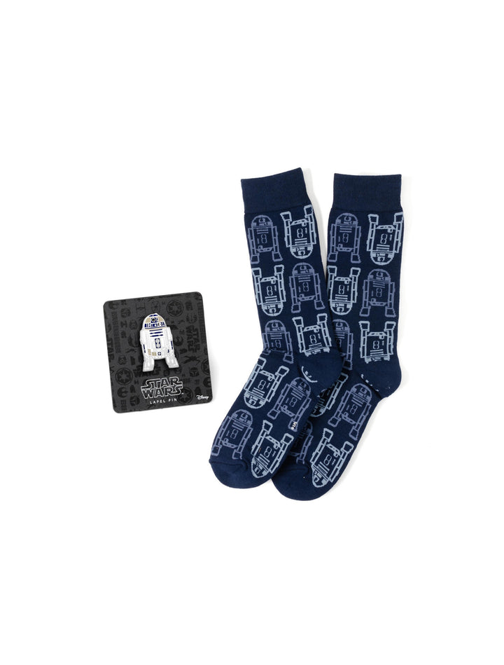 A pair of navy blue Star Wars R2-D2 Light and Dark Blue Dress Socks and Lapel Pin Gift Set, featuring a repeating white R2-D2 pattern and a metal lapel pin on a branded display card.