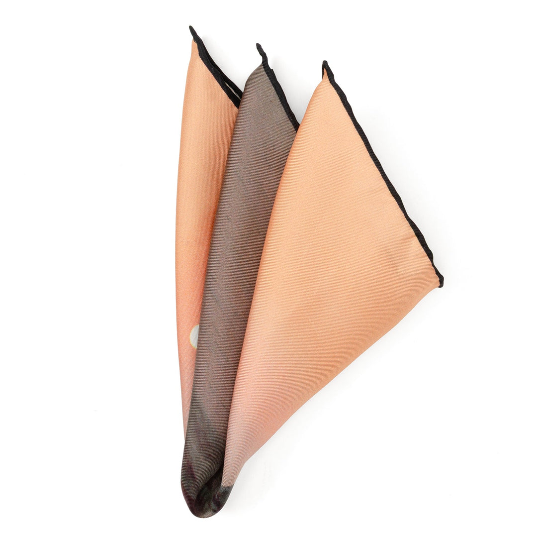 A folded Star Wars Tatooine Binary Sunset Pocket Square featuring an orange and brown landscape with two suns.