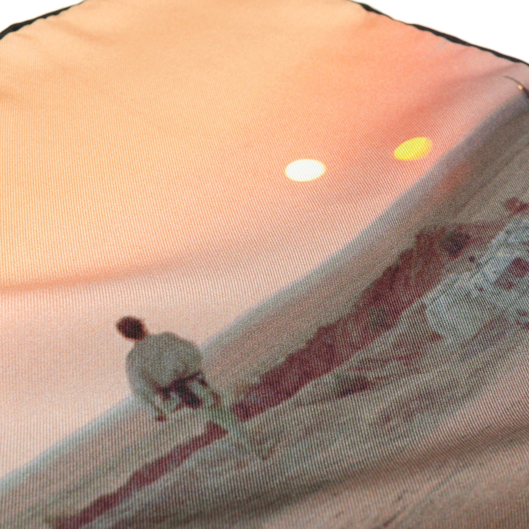 Star Wars Tatooine Binary Sunset Pocket Square featuring a printed scene of a person standing on a desert dune under two suns.