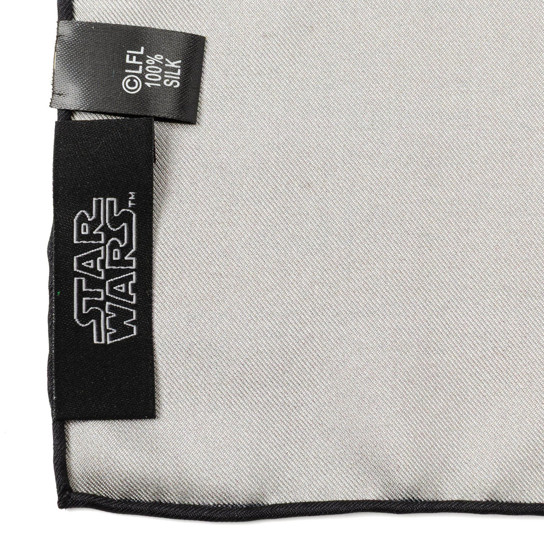 Close-up of a plain light gray Star Wars Tatooine Binary Sunset Pocket Square with a black logo label and a care tag reading 100% silk.