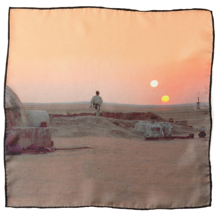 A square Star Wars Tatooine Binary Sunset Pocket Square printed with the iconic scene of a figure looking out at two suns setting over a desert landscape.