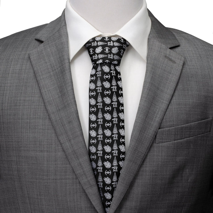 Star Wars Ships Black Tie with a repeating pattern of white starships, worn with a white collared shirt and a gray suit jacket.