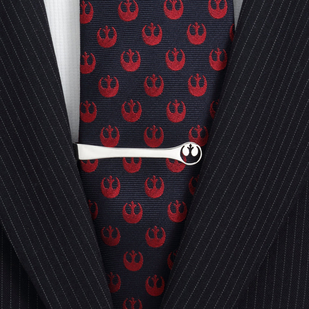 Star Wars Rebel Alliance Crest Cutout Sterling Silver Tie Bar worn on a dark tie with a repeating red crest pattern over a pinstripe suit jacket.