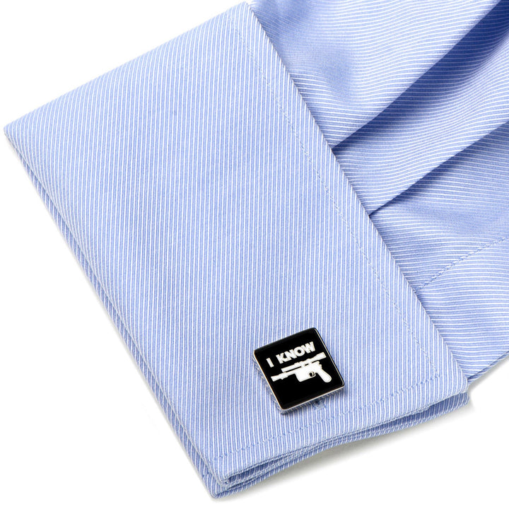 Square black Star Wars Princess Leia and Han Solo “I Love You / I Know” Icon Cufflinks featuring a white blaster graphic and “I KNOW” text on a light blue dress shirt cuff.