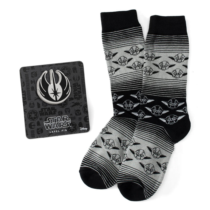 Cufflinks.com Star Wars Yoda Gray and Black Ombre Pattern Dress Socks and a circular Jedi crest lapel pin on a display card.