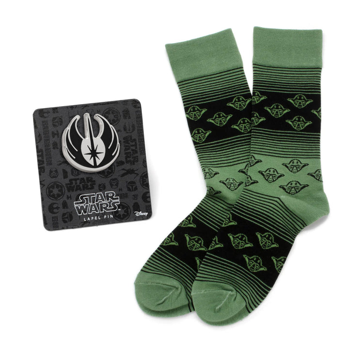 Star Wars Yoda Green and Black Ombre Pattern Dress Socks with Jedi Crest Lapel Pin, featuring a Yoda pattern and a silver Jedi symbol lapel pin on a display card.