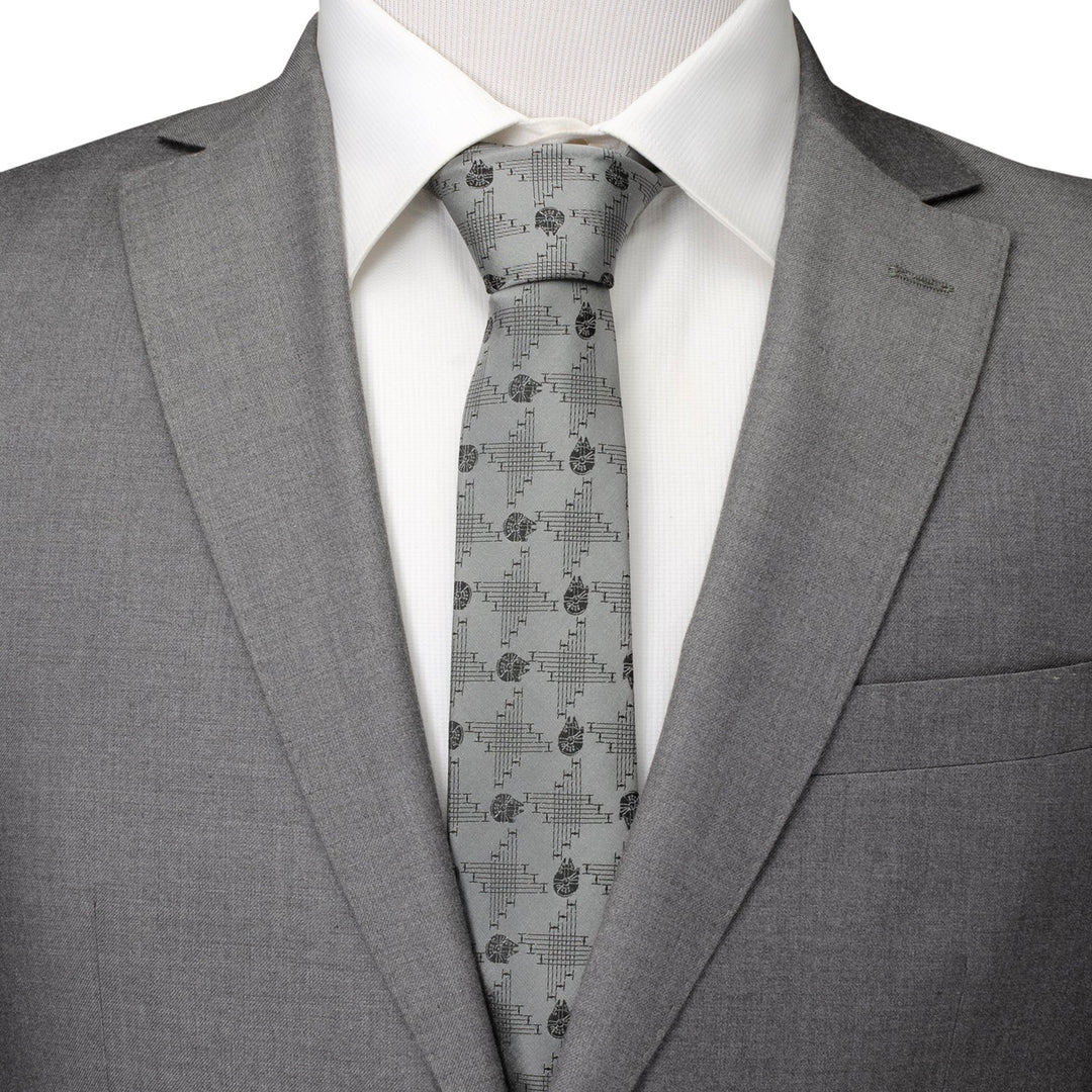 Star Wars Millennium Falcon Gray Tie in a silk blend, featuring a repeating pattern of starships over a geometric grid, worn with a white dress shirt and gray suit jacket.