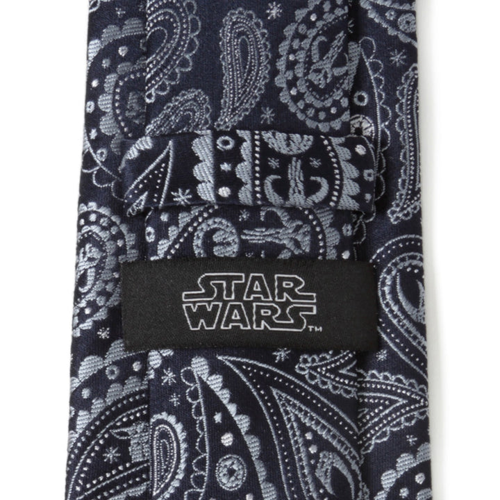 Star Wars Mandalorian Blue Paisley Tie in dark blue with a grey paisley pattern, small Mandalorian helmets, and a brand label on the back.