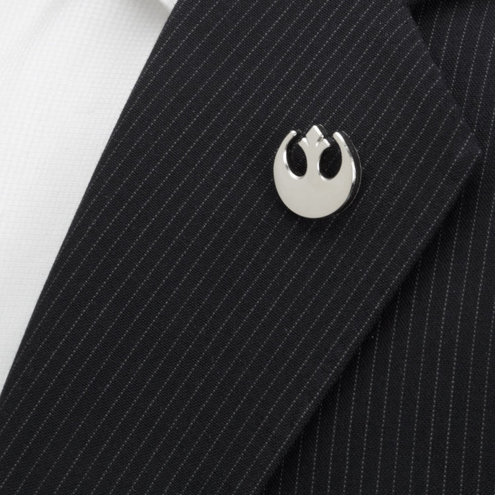 A silver Rebel Alliance symbol lapel pin from the Star Wars Mod Alliance Gift Set attached to a black pinstriped suit jacket.