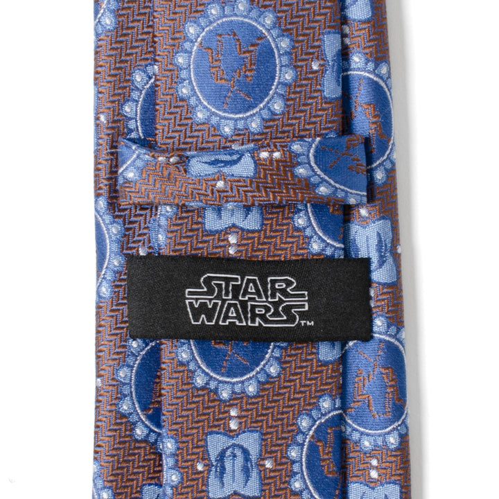 Blue Star Wars Obi-Wan Kenobi and Anakin Skywalker LIGHTSABER Battle Blue Tie with a brown herringbone pattern and a black Cufflinks.com label on the back.
