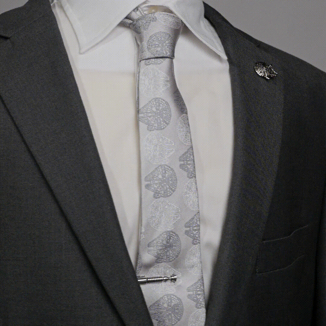 Silver-toned metal Star Wars Obi-Wan Kenobi Tie Clip worn on a patterned tie with a suit.