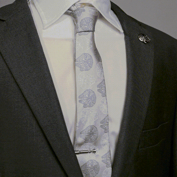 Silver-toned metal Star Wars Obi-Wan Kenobi Tie Clip worn on a patterned tie with a suit.