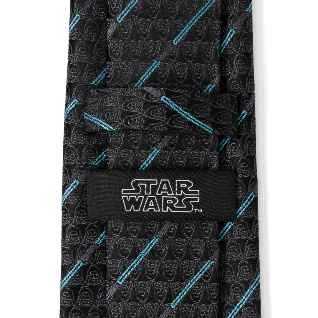 Star Wars Obi-Wan Kenobi LIGHTSABER Pattern Black Tie featuring a repeating pattern of faint Darth Vader helmets and thin blue lightsaber blades, with a logo label sewn on the back.