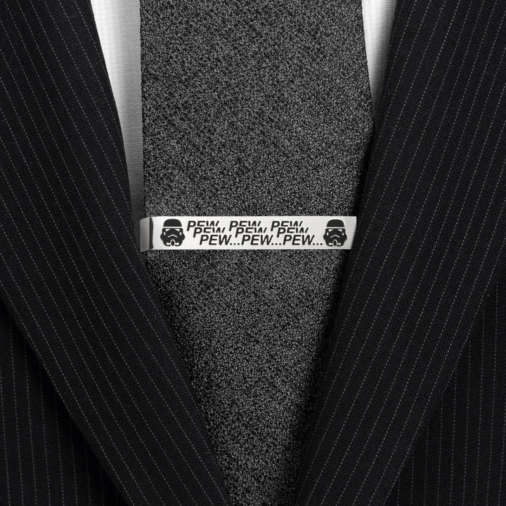 Star Wars Stormtrooper Pew Pew Pew Tie Bar in silver-tone featuring Stormtrooper helmets and “PEW PEW PEW” text, pinned to a black textured necktie.
