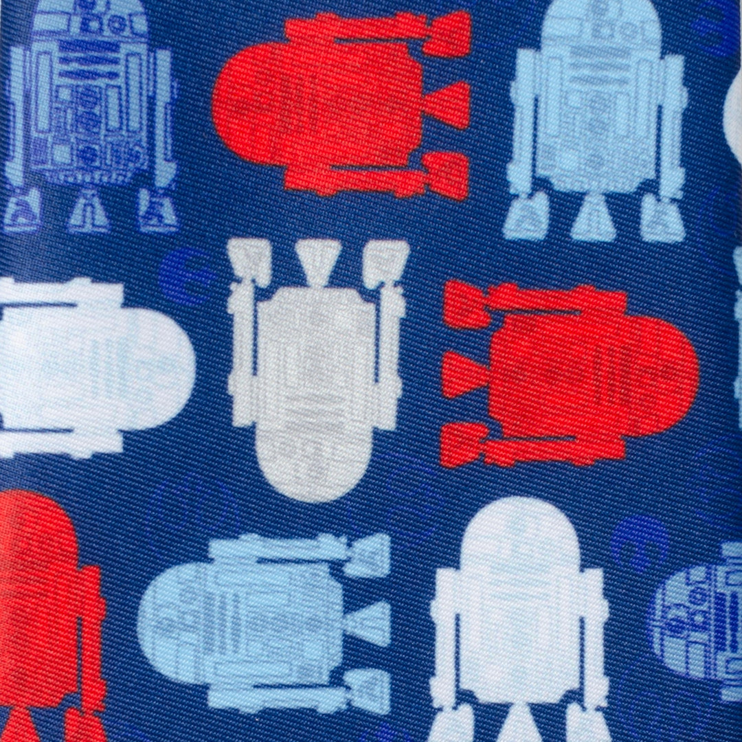 A blue Star Wars R2-D2 Red, White, and Blue Tie by Cufflinks.com featuring a repeating pattern of R2-D2 silhouettes in red, white, and light blue.