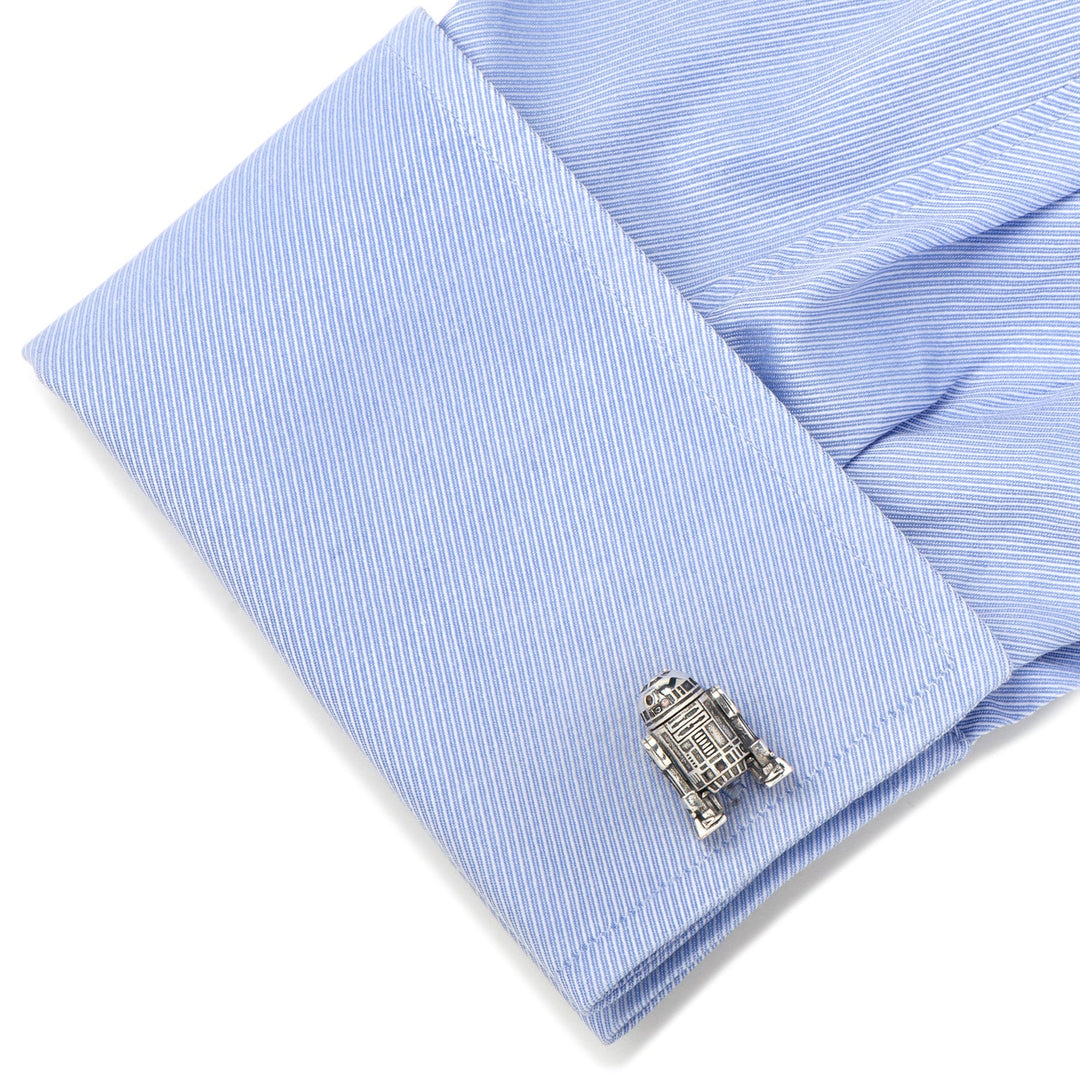Silver-toned Star Wars R2-D2 3D Cufflinks fastened to a light blue dress shirt cuff.