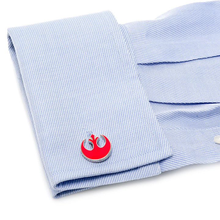 Round silver Star Wars Rebel Alliance Starbird Crest Red Cufflinks featuring a red crest attached to a light blue pinstriped French cuff.