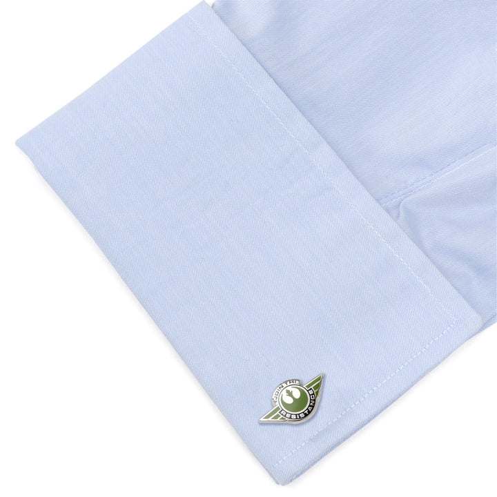 A light blue French cuff sleeve fastened with green and silver Star Wars Rebel Alliance Starbird Crest Badge Cufflinks.