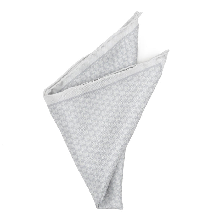 Star Wars Stormtrooper White Silk Pocket Square folded into a triangle, featuring an all-over repeating pattern of light gray Stormtrooper helmets.