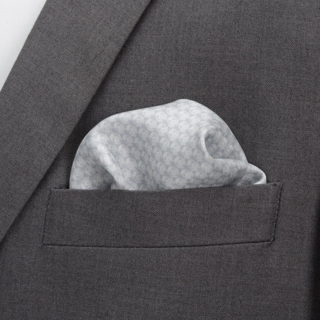 Star Wars Stormtrooper White Silk Pocket Square featuring a subtle, repeating helmet pattern tucked into the chest pocket of a grey suit jacket.