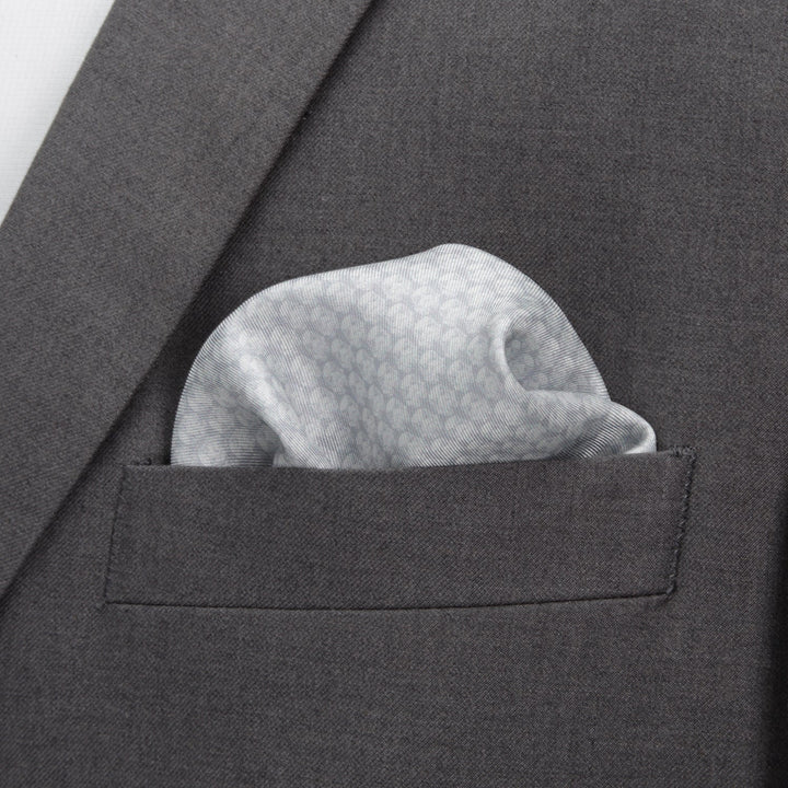 Star Wars Stormtrooper White Silk Pocket Square featuring a subtle, repeating helmet pattern tucked into the chest pocket of a grey suit jacket.