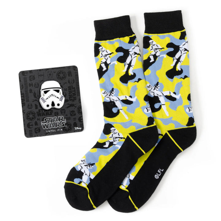 Star Wars Stormtrooper Yellow Camo Dress Socks and Lapel Pin Gift Set featuring yellow and blue camo socks with a matching white Stormtrooper helmet lapel pin on a display card.