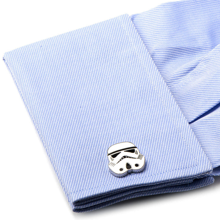 Silver-tone Star Wars Stormtrooper - Cufflinks attached to a light blue dress shirt cuff.